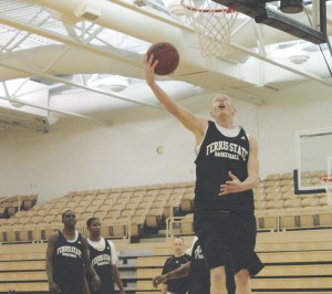 Reach for the Sky: Senior Austin Randel polishes up his slam dunk style at practice. The season opening game took place this Sunday in Illinois, ending with a close 65-60 loss to the Lewis Flyers. Photo By: Kate Dupon | Photographer Reach for the Sky: Senior Austin Randel polishes up his slam dunk style at practice. The season opening game took place this Sunday in Illinois, ending with a close 65-60 loss to the Lewis Flyers. Photo By: Kate Dupon | Photographer