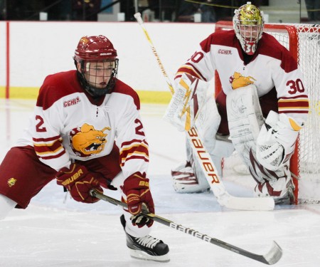 Victory at Home: Freshman Defenseman Scott Czarnowczan helps goalie Pat Nagle defend the net during the St. Lawrence game this weekend. The Bulldogs swept the home-opening series, bringing their 2010-11 record to 3-1. Photo By: Brock Copus | Photographer Victory at Home: Freshman Defenseman Scott Czarnowczan helps goalie Pat Nagle defend the net during the St. Lawrence game this weekend. The Bulldogs swept the home-opening series, bringing their 2010-11 record to 3-1. Photo By: Brock Copus | Photographer