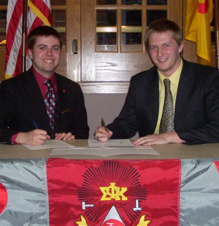 Frat Scholarship: Matt Valleau and William Mitch sign documents for the new Phi Sigma Kappa Emerging Leaders Scholarship available to incoming freshmen. The two fraternity brothers began planning the scholarship last summer. Photo Courtesy of Jacob Martin Frat Scholarship: Matt Valleau and William Mitch sign documents for the new Phi Sigma Kappa Emerging Leaders Scholarship available to incoming freshmen. The two fraternity brothers began planning the scholarship last summer. Photo Courtesy of Jacob Martin