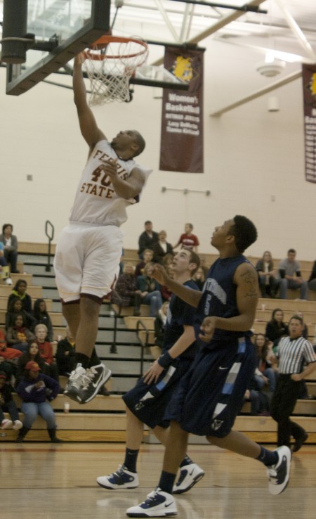 Beating Northwood: Justin Keenan dunks a ball during a game against Northwood on Dec. 11. The Bulldogs recently played Northwood on Jan. 15 and won 94-85. Photo By: Kate Dupon | Photo Editor