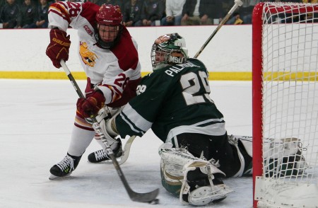 Defeating the Spartans: Kyle Bonis attempts to knock a puck into the net against the Spartan’s goalie. The Bulldogs defeated MSU 2-1 on Jan. 27, bringing the 2010-11 record to 12-12-4 overall. Photo By: Brock Copus | Photographer Defeating the Spartans: Kyle Bonis attempts to knock a puck into the net against the Spartan’s goalie. The Bulldogs defeated MSU 2-1 on Jan. 27, bringing the 2010-11 record to 12-12-4 overall. Photo By: Brock Copus | Photographer