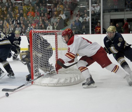 Season Ending: Freshman Cory Kane attempts to score during the Bulldogs’ Feb. 18 game against Notre Dame. The Bulldogs fell to Western Michigan in the CCHA Quarterfinals, eliminating them from the CCHA Tournament. Photo By: Brock Copus | Photographer