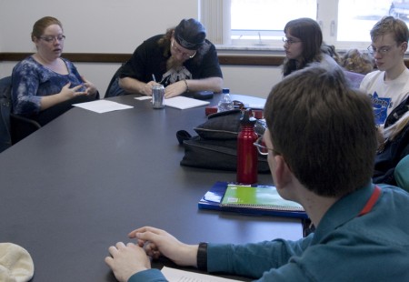 Creative Writing: WRITE members Kevin Okerhjelm, Chris Brown, Amanda Wood and James Young, right to left, listen as Rebecca Young, top left, reads a piece of her writing. The RSO gives students the opportunity to use creative writing and express themselves. Photo By: Kate Dupon | Photo Editor
