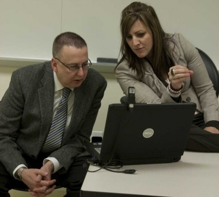 Gearing Up: David Verbeek and Dawn Tahaney, Ferris MBA students, prepare for their presentation in the case study competition hosted by the Association for Corporate Growth. Photo By: Kate Dupon | Photo Editor Gearing Up: David Verbeek and Dawn Tahaney, Ferris MBA students, prepare for their presentation in the case study competition hosted by the Association for Corporate Growth. Photo By: Kate Dupon | Photo Editor