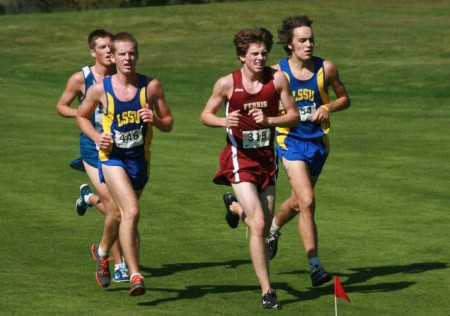 Pushing Forward: Alex Waldvogel, FSU freshman, passes a group of Lake Superior State runners during the Ray Helsing Invitational. Photo By: Kate Dupon | Photo Editor Pushing Forward: Alex Waldvogel, FSU freshman, passes a group of Lake Superior State runners during the Ray Helsing Invitational. Photo By: Kate Dupon | Photo Editor