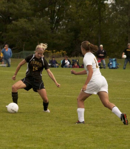 Manuevering Tech: Kasey Ruimveld, senior defender, manuevers past a Michigan Tech opponent during the Sept. 17 game. Photo By: Kate Dupon | Photo Editor