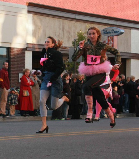 Running for a Cause: Dozens of students and community members put on their heels and ran to support the Susan P. Wheatlake Cancer and Wellness Center. Photo By: Kate Dupon | Photo Editor Running for a Cause: Dozens of students and community members put on their heels and ran to support the Susan P. Wheatlake Cancer and Wellness Center. Photo By: Kate Dupon | Photo Editor