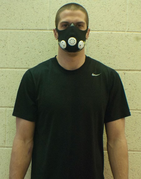 Masking It: Elevation masks were donated to the Ferris football team to help improve lung stamina. Shown above on sophomore quarterback Taylor Masiewicz, the mask covers the nose and mouth to reduce the level of oxygen intake. Photo By: Tori Thomas | Photographer