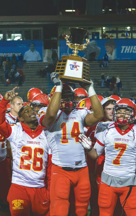 Graduated defensive end Jordan Morgan hoists up the Anchor-Bone trophy after defeating Grand Valley in the 2012 season. Ferris will fight for the trophy again against Grand Valley on Oct. 12. Courtesy Photo Provided By: Rob Bently
