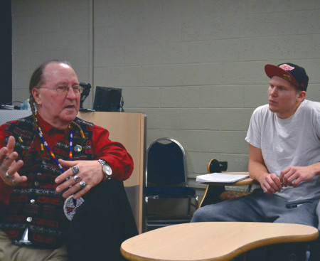 A Big Rapids community member shares his thoughts during the “Imaginary Indians” event on Feb. 25. The event analyzed derogatory artifacts and images of Native Americans created by popular white culture. Photo By: Corey Saladin | Interim Photographer