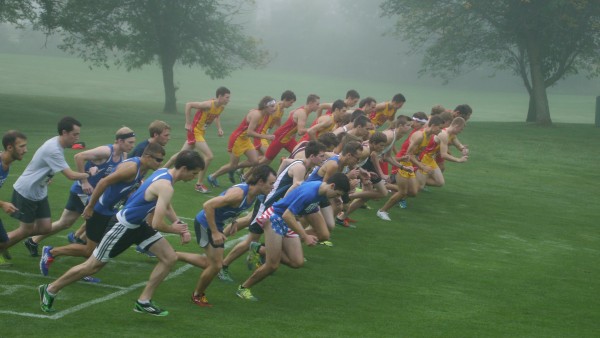 Runners from three different schools take off into the foggy morning at the annual Ray Helsing Invitational hosted on Ferris' own Katke Golf Course.