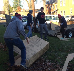 Participants volunteered at the Salvation Army in Big Rapids, moving and breaking down cardboard boxes to be recycled.