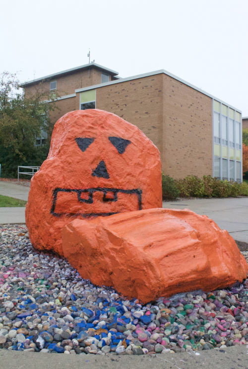 According to several students, the rock in front of the Rock Café had been haphazardly covered with orange paint before being transformed into the jack-o’-lantern above. 