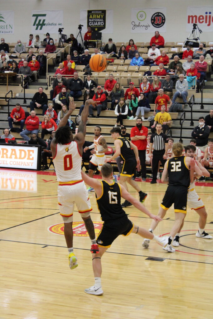 Walt Kelser shoots a three 